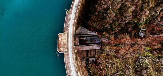 an aerial view of a bridge over a body of water by spiros xanthos courtesy of Unsplash.